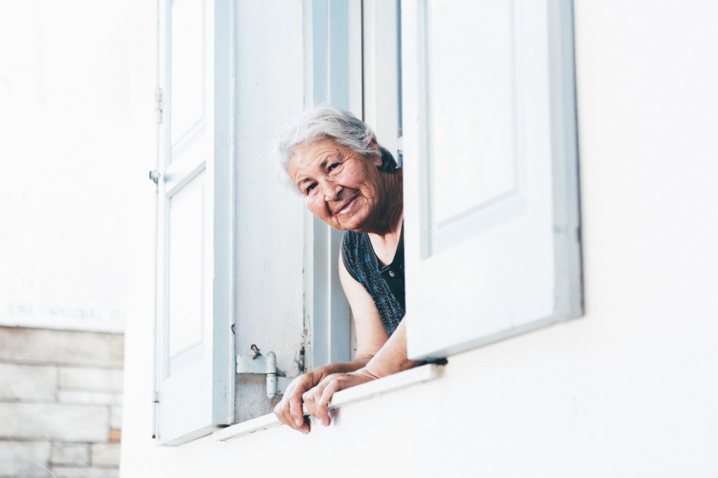 Skincare limits for anti-aging beautiful grey haired woman smiling